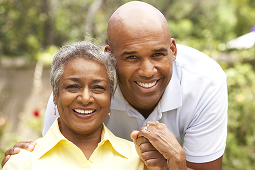 African american mother and son smiling outside